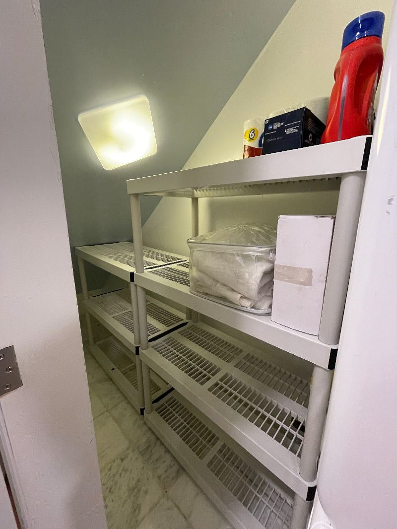 shelves for storage plus suitcases or larger items in laundry closet