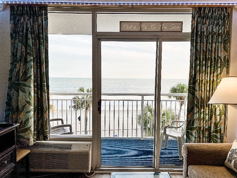 Sliding glass door to the balcony overlooking the ocean