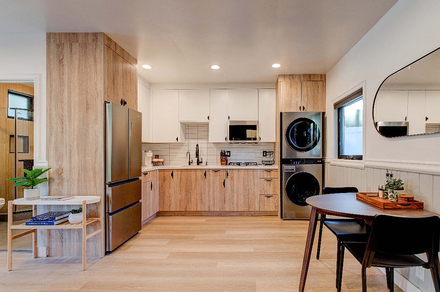 Full Size Refrigerator, and full size washer/dryer with starter detergent and dryer sheets.