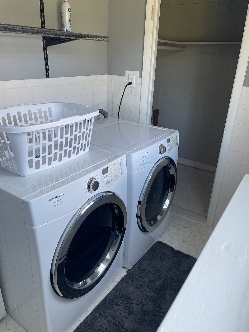 Full laundry room inside unit with extra storage space/closet.