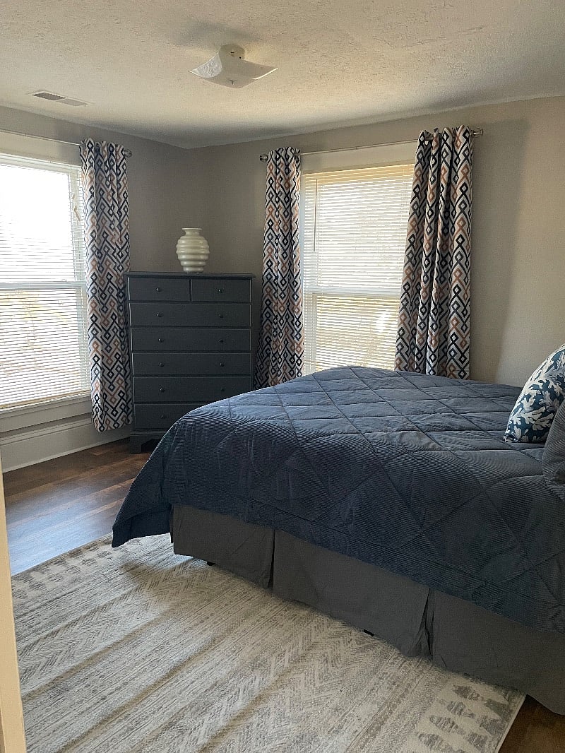 Bedroom 1 offers a queen, small closet, and large dresser. 