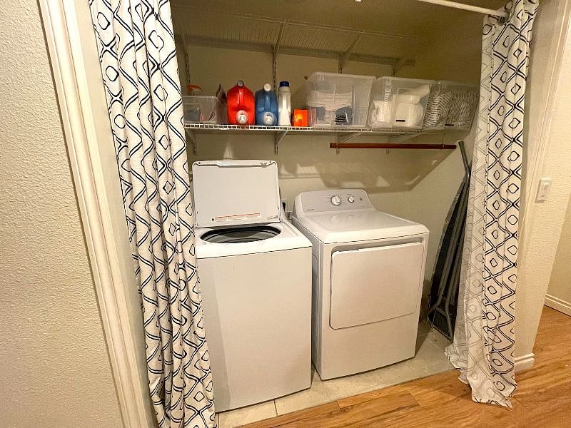 Laundry nook with washer and dryer, extra towels and bedding