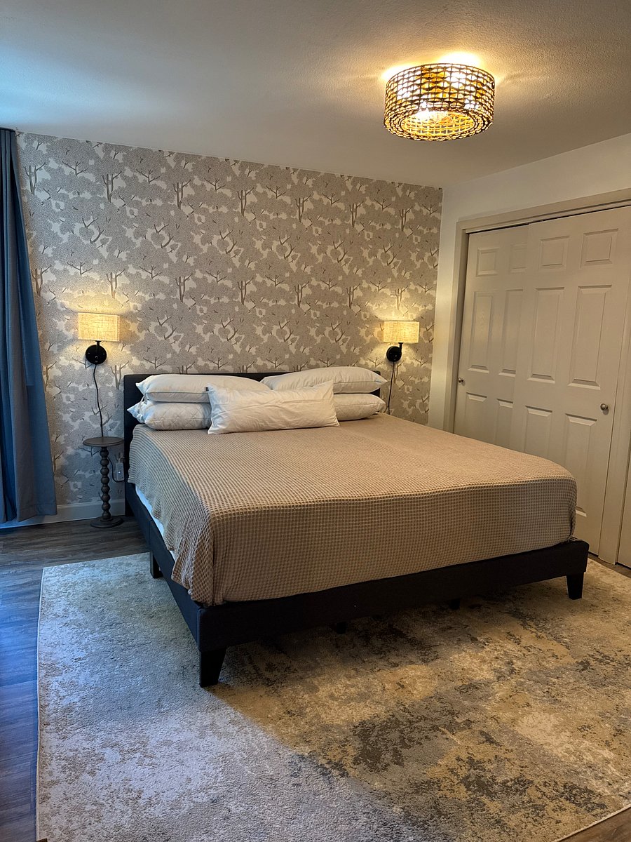 Bedside lighting, 2 memory foam and 2 down filled pillows.  This room also has a half bath and built in desk