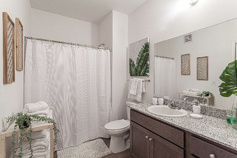Large Bathroom with washer & dryer inside.