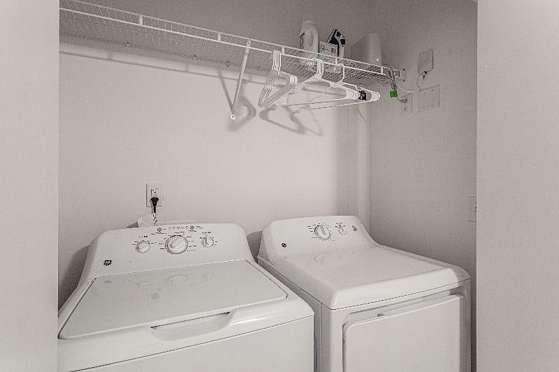 Washer dryer in bathroom closet.