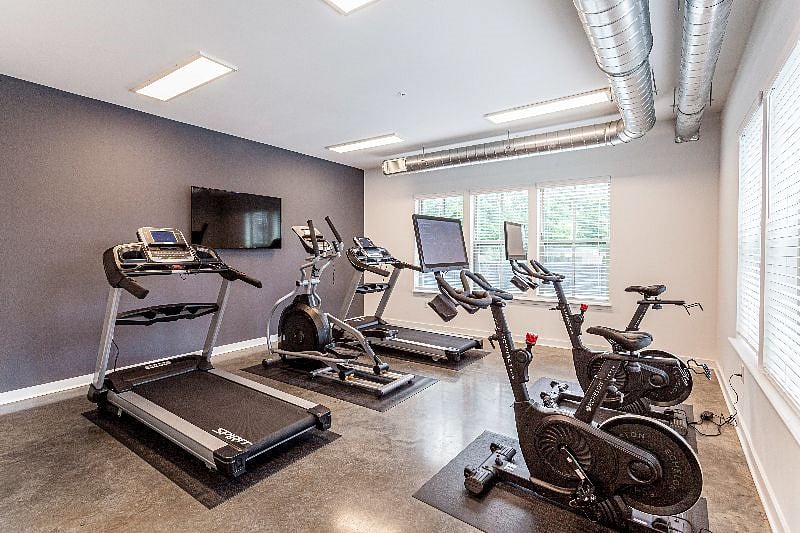 Treadmill & Bikes inside gym.