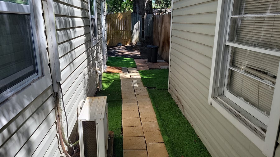 Private walkway, 2nd units garage to right. Door on other side of gate, (garage only used for storage, so quiet.)