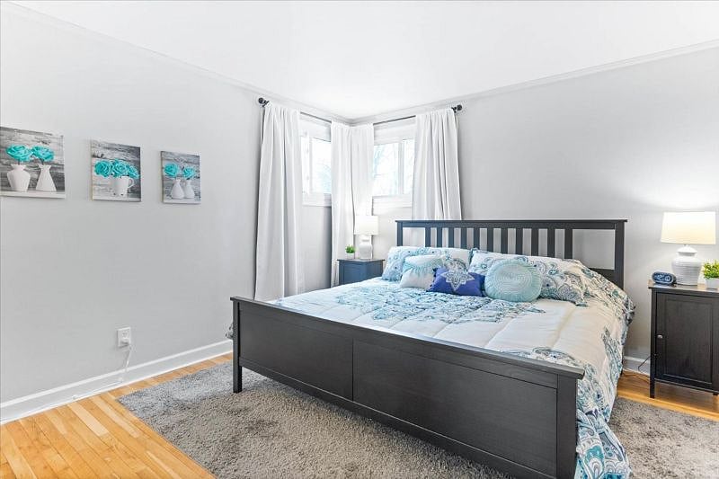 Primary Bedroom with King bed and blackout curtains