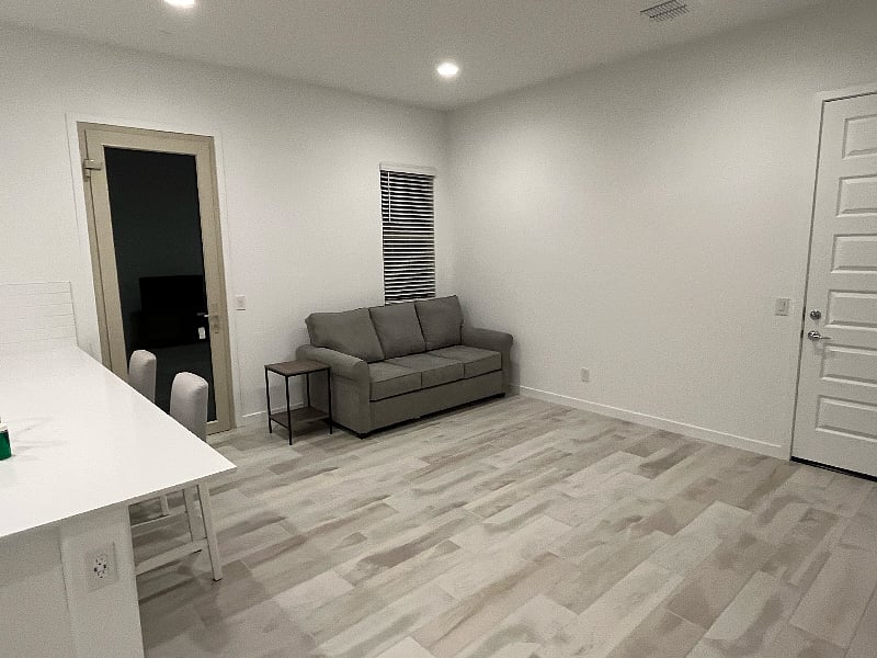 Living room area with access to private patio