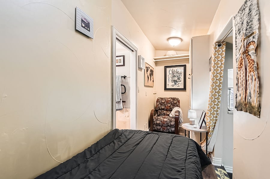 When our daughter was younger, we converted the walk-in closet into her bedroom. Accessed through the ensuite bathroom, it's a cozy space with two twin beds.