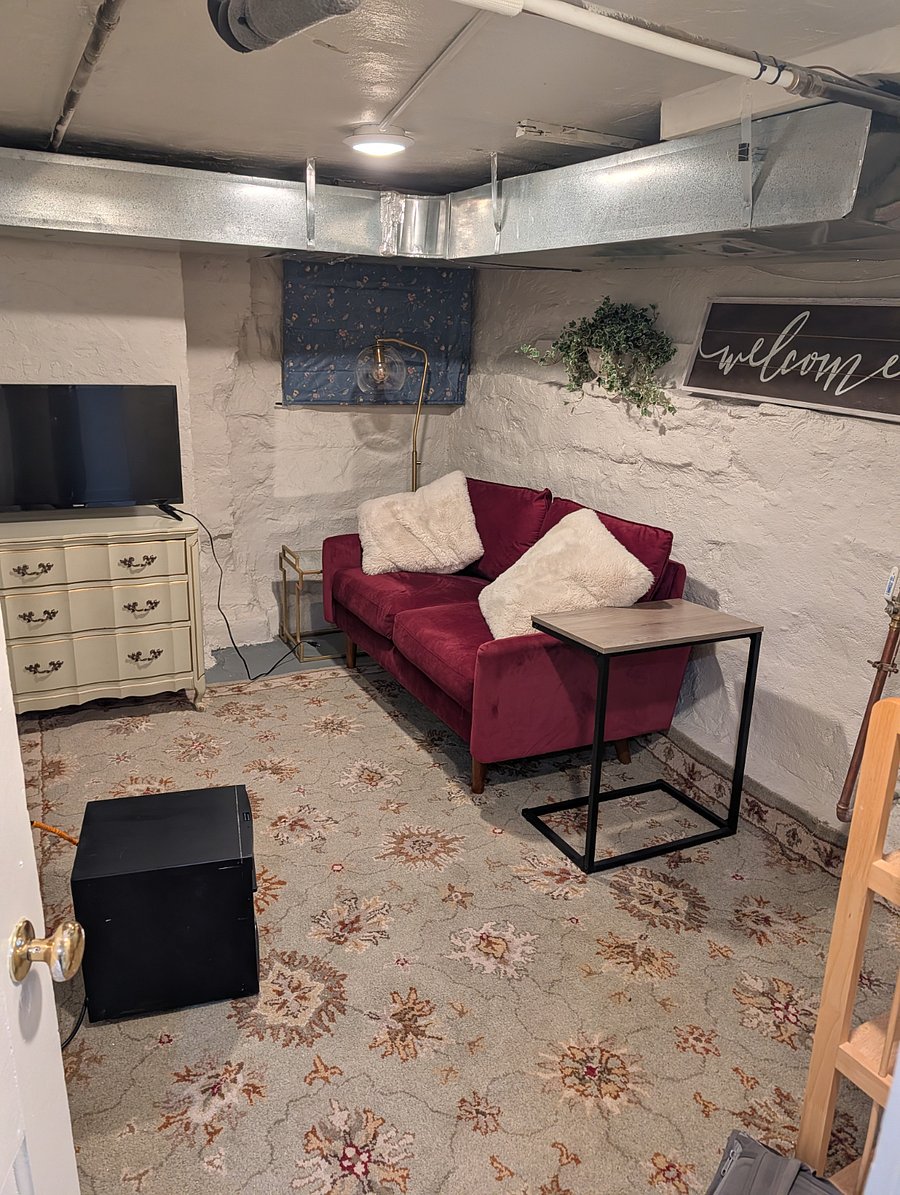 living room with TV, couch and table
