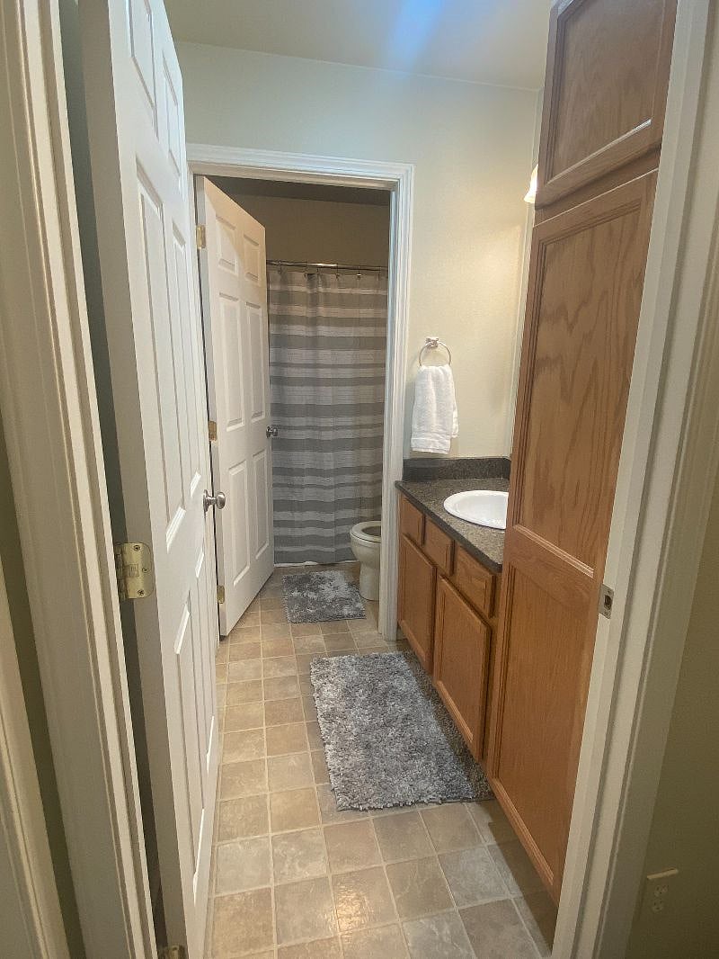 shared bath between bedrooms 1 and 2. Separate commode room.