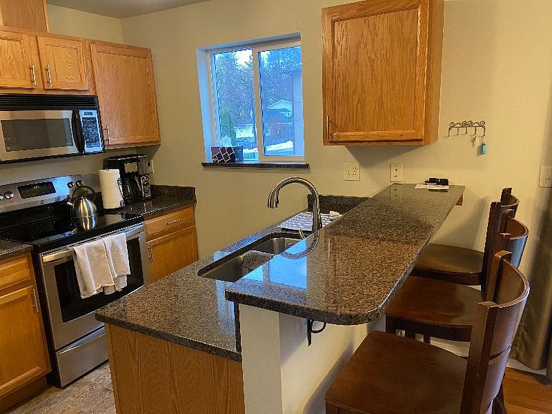 Full kitchen with granite counter tops