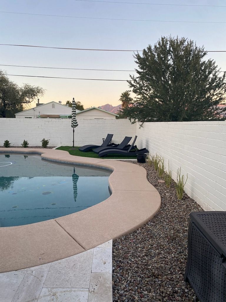 Pool with turf and deck