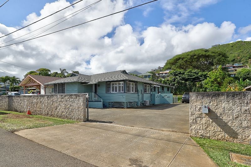 Driveway has a sliding gate to fully enclose the property.