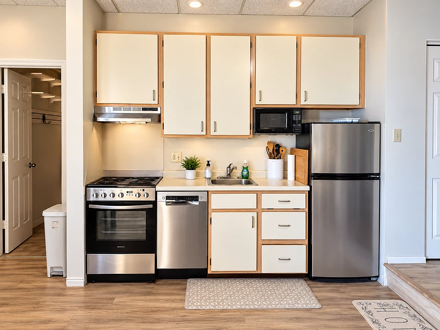 Kitchen with newer appliances. A large walk-in pantry to the left.
