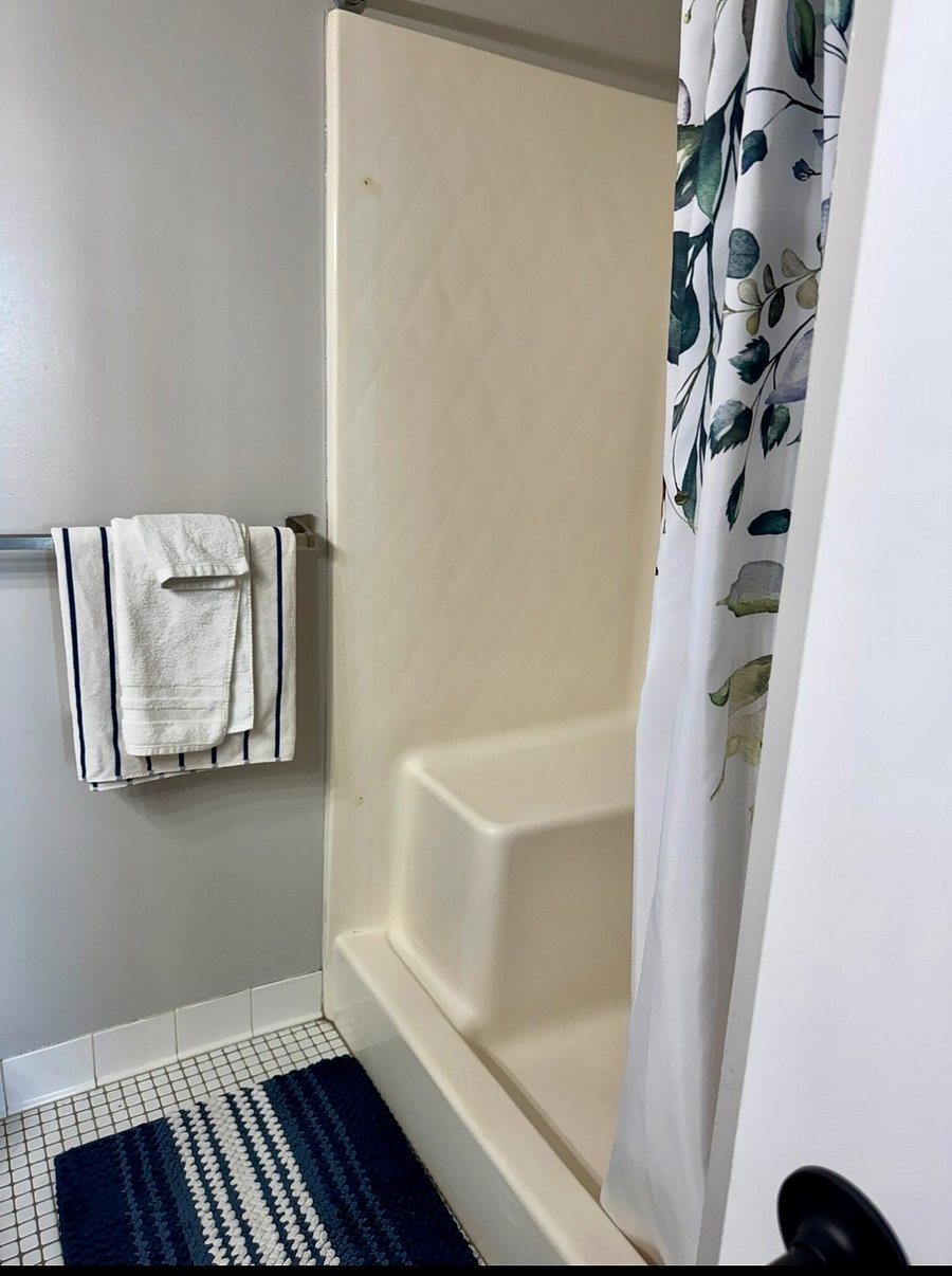 Second bathroom with a standup shower & bench