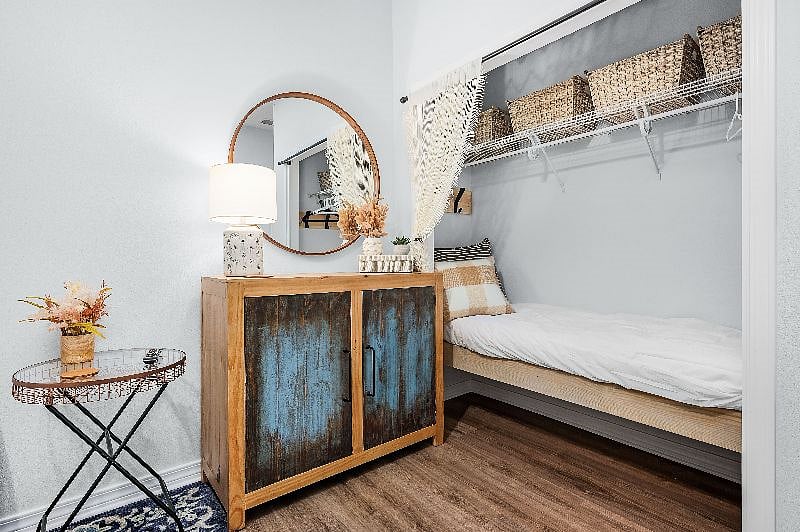 Closet with Baskets, Hooks, Hangers as well a Small Child could sleep here