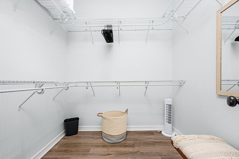 Huge Master Closet with Mirror and Bench