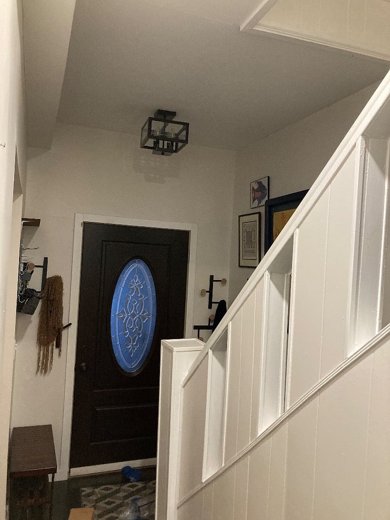 stairs to first floor and front door