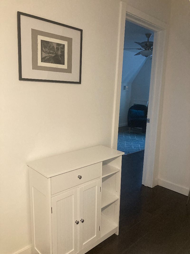 hallway with storage from bedroom