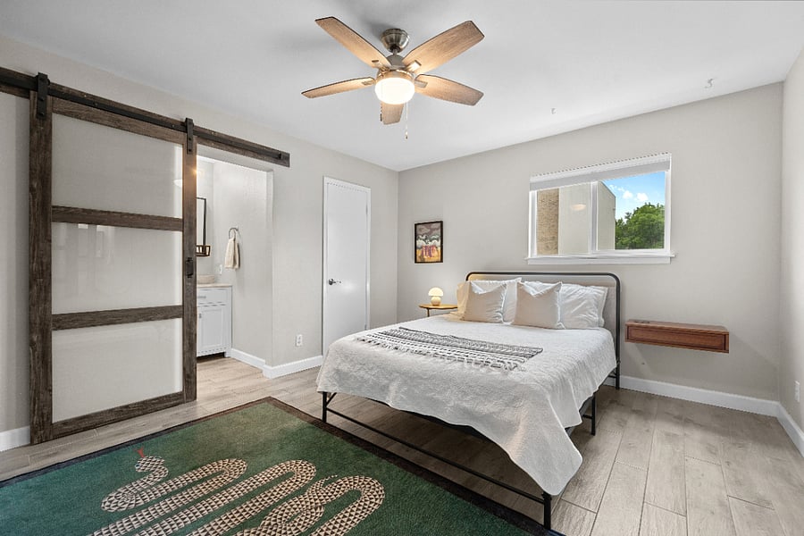 Primary bedroom, queen mattress. Walk-in closet with Elfa shelving.
Top-down, bottom-up shades (blackout in bedrooms) maximize privacy and natural light.