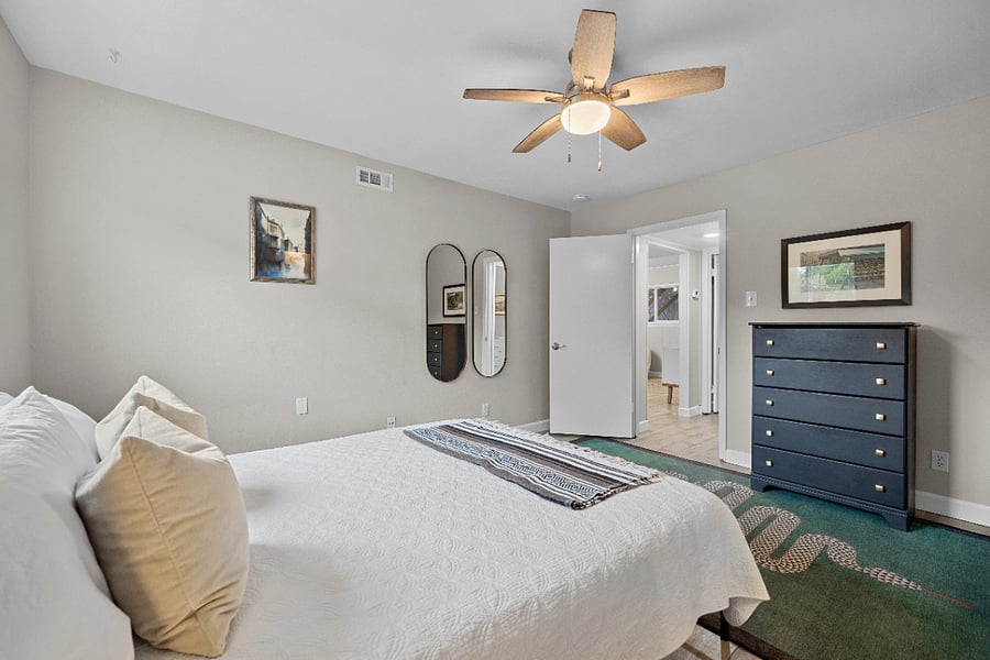 Primary bedroom, queen mattress. Walk-in closet with Elfa shelving.
Top-down, bottom-up shades (blackout in bedrooms) maximize privacy and natural light.