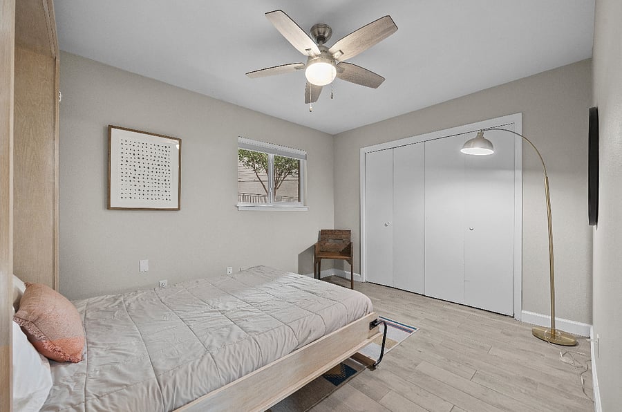 Secondary bedroom: A queen-sized Murphy bed allows for a seamless switch between the office and bedroom!
Top-down, bottom-up shades (blackout in bedrooms) maximize privacy and natural light.