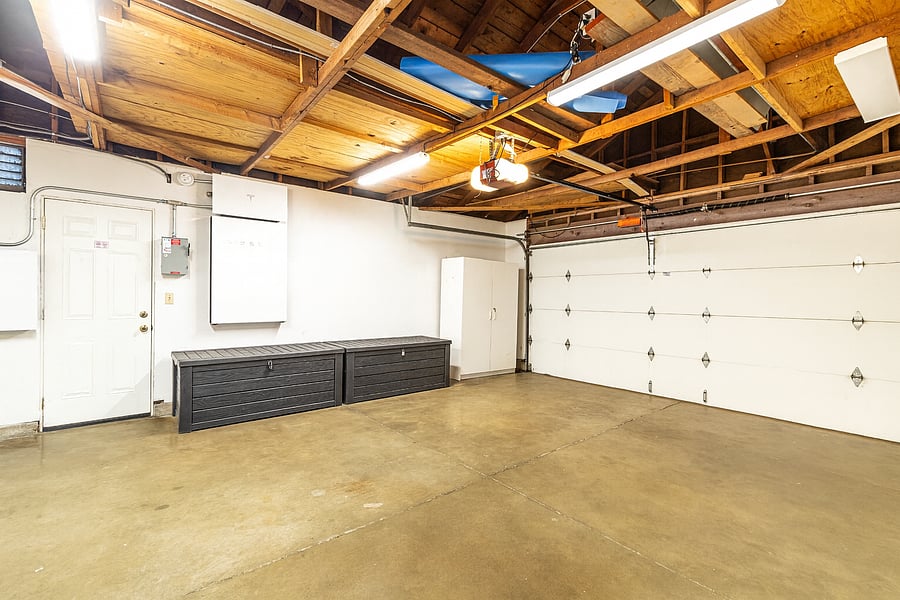 Spacious attached 2-car garage with EV charger, washer/dryer, and plenty of room for parking or storage!