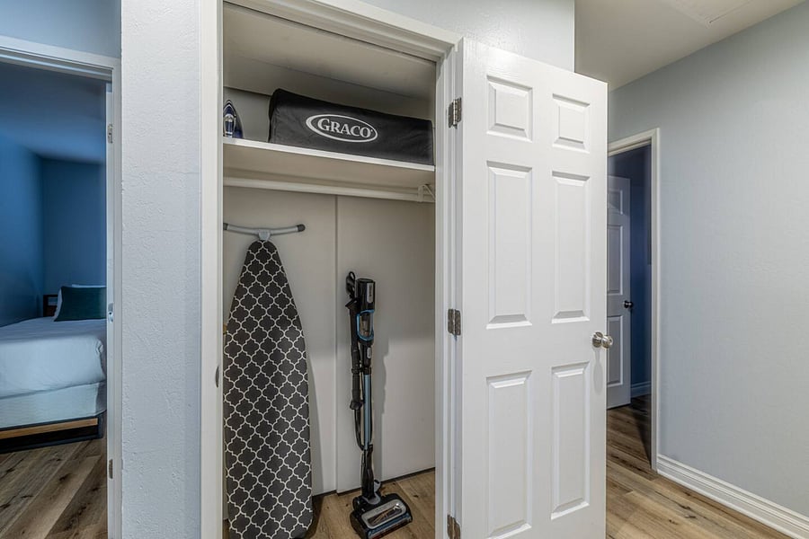The house includes a Pack 'n Play, a vacuum, and an iron with an ironing board for your convenience.