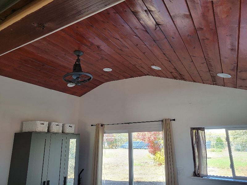 Wood-paneled bedroom ceiling