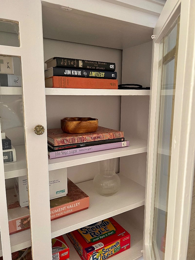 Entertainment shelf filled with books and games