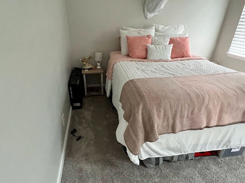 Bedroom 2 also includes a desk and workspace area in opposing corner as well as a closet and full-length mirror (not pictured)