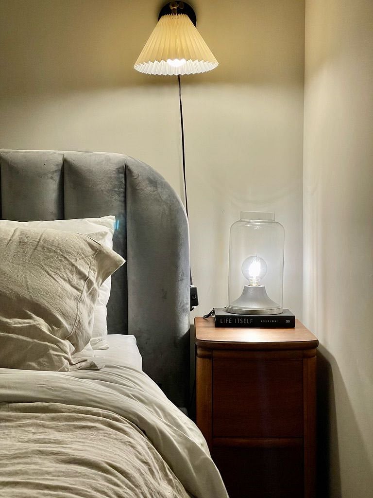 Aside from the bedroom's inviting style, the mattress is an Avocado Organic 10 inch memory foam and the Brooklinen thread count is 300+. You will be just fine!