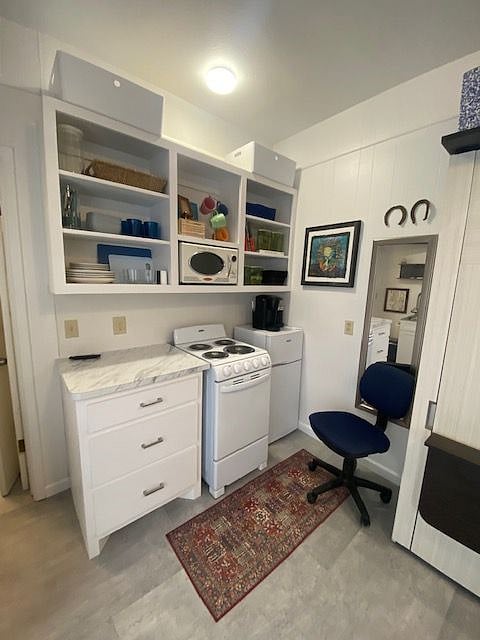 The kitchenette is equipped with a cooktop, oven, fridge, microwave and Keurig coffee maker. In addition, it has plates, silverware, pots, pans, etc.!