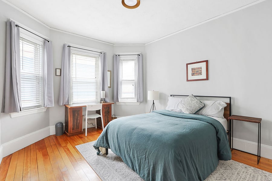 Second bedroom with full bed, desk, and closet