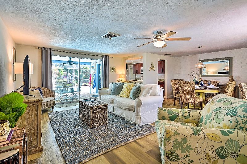 Casual, cozy living room setting with updated flooring throughout.