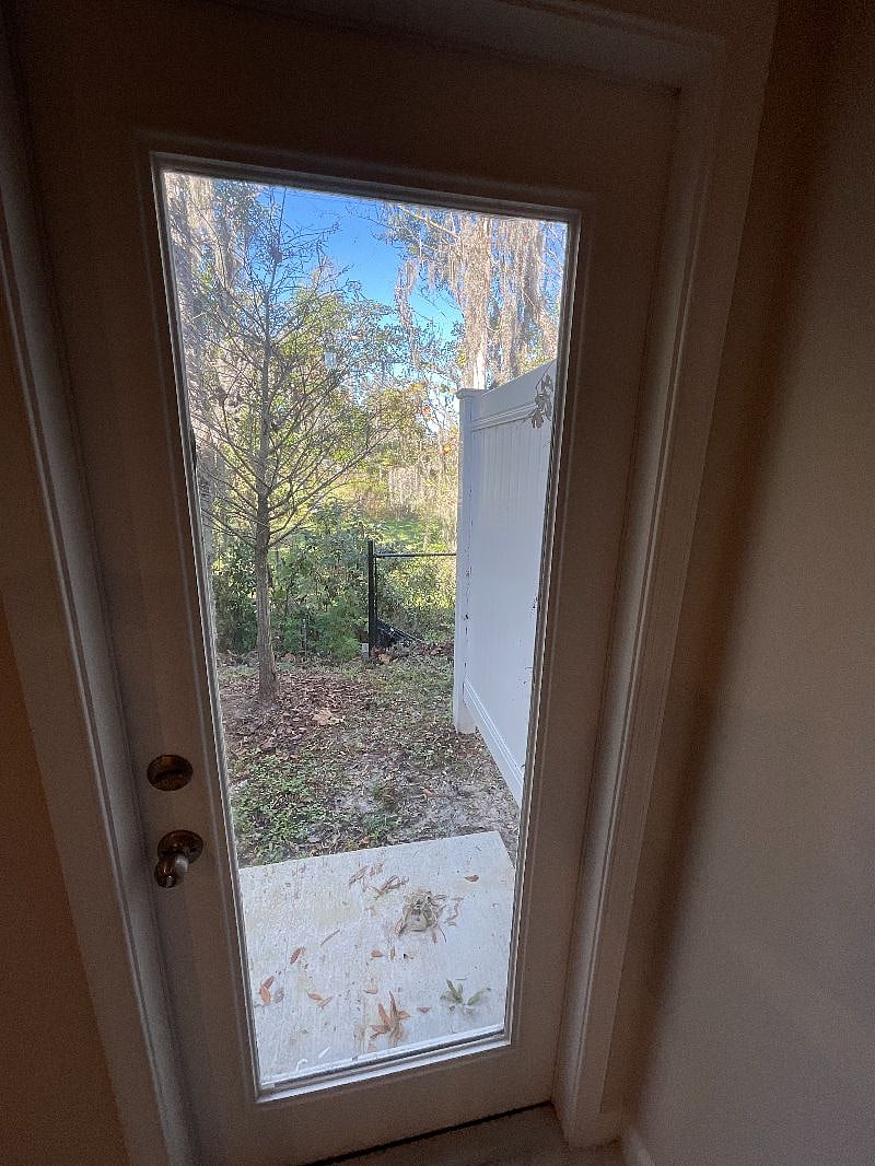 Small patio backing to the woods for optimal privacy.