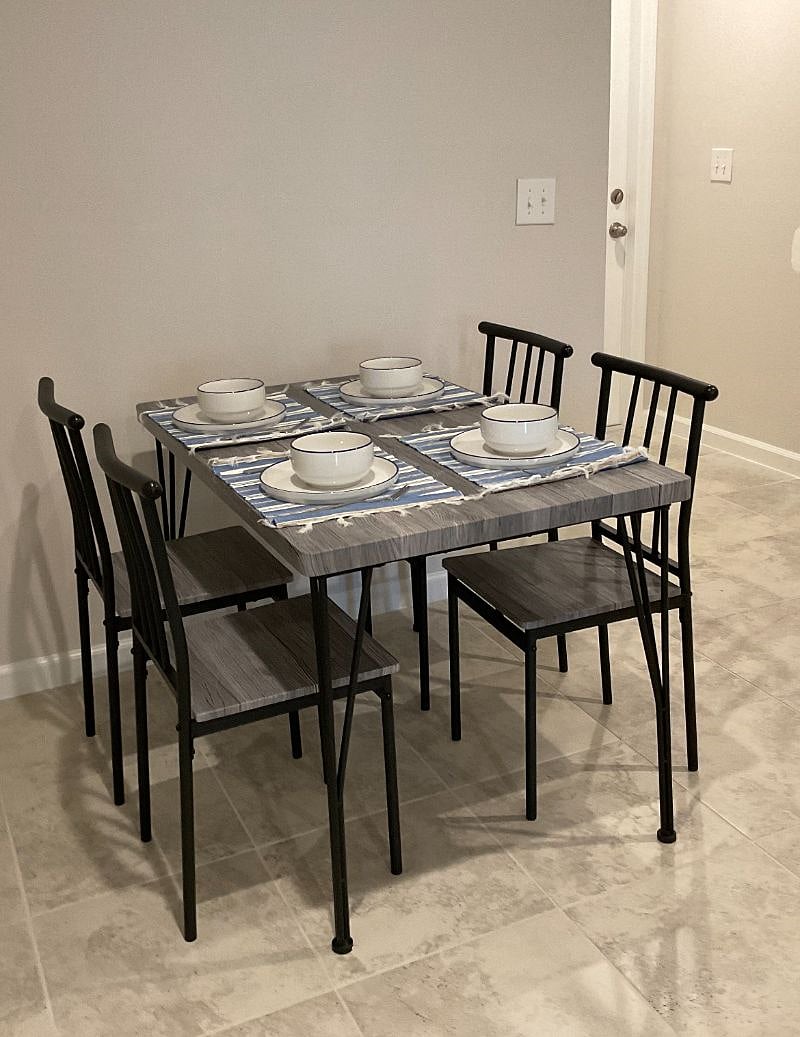 Dining table with additional seatinmg at the bar with bar stools