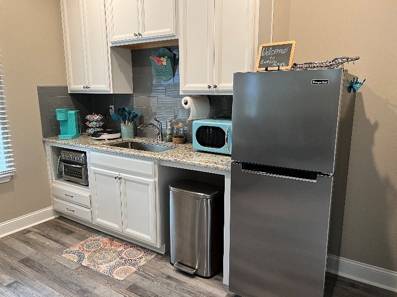 Kitchenette complete with inductions cooktop, induction cookware, refrigerator/freezer, microwave, Keurig coffee maker, multiple appliances and dinnerware for 4.