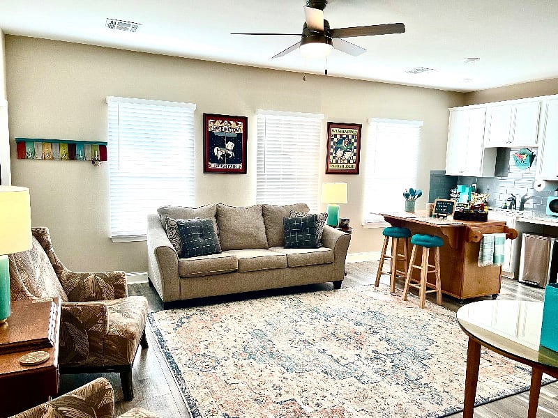 Sealy sleeper/sofa with queen sheet set and lots of blankets and linens.