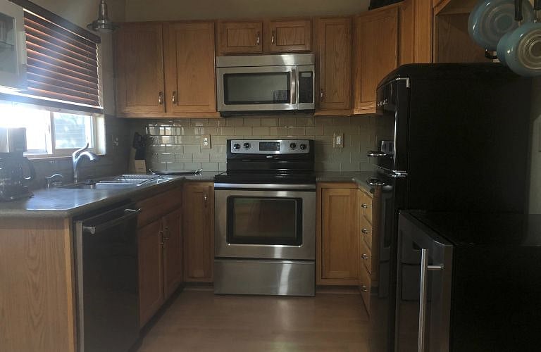 Full kitchen overlooking the park.