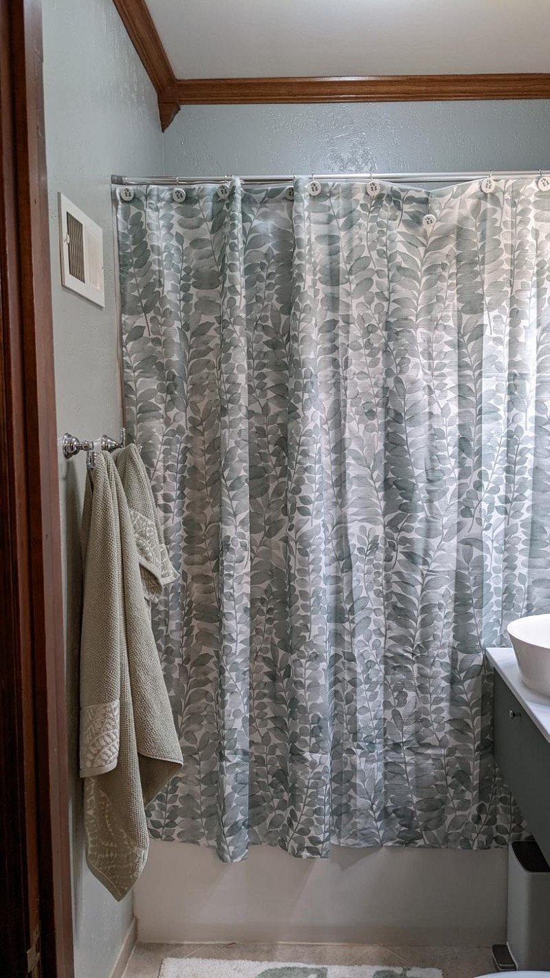 Shared bathroom: linen closet partly visible to the left