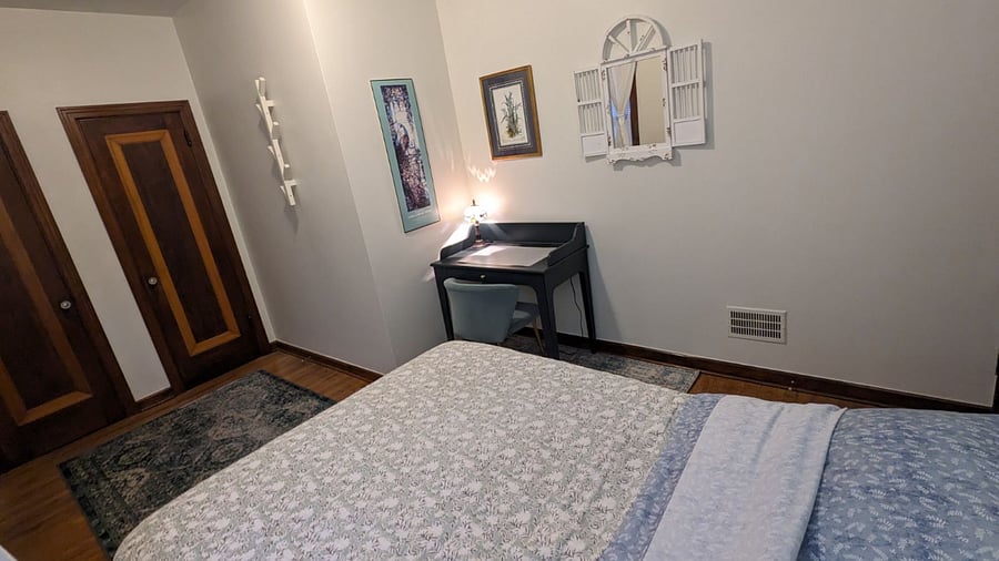 Private bedroom with Full bed, desk, and double closet.