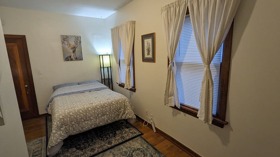 Private bedroom with Full bed, desk, and double closet.