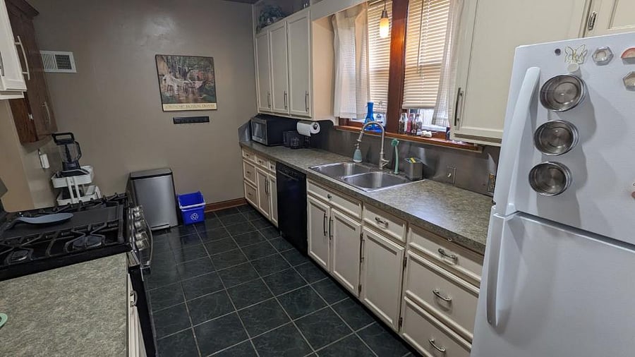 Kitchen (shared with basement tenants) with dishwasher, gas range stove/oven, full size refrigerator/freezer, tea and coffee stations, air fryer, blender, toaster, etc.