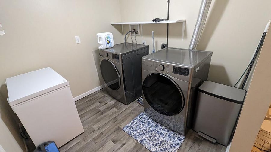 Laundry room downstairs in the finished basement with full-size washer & dryer