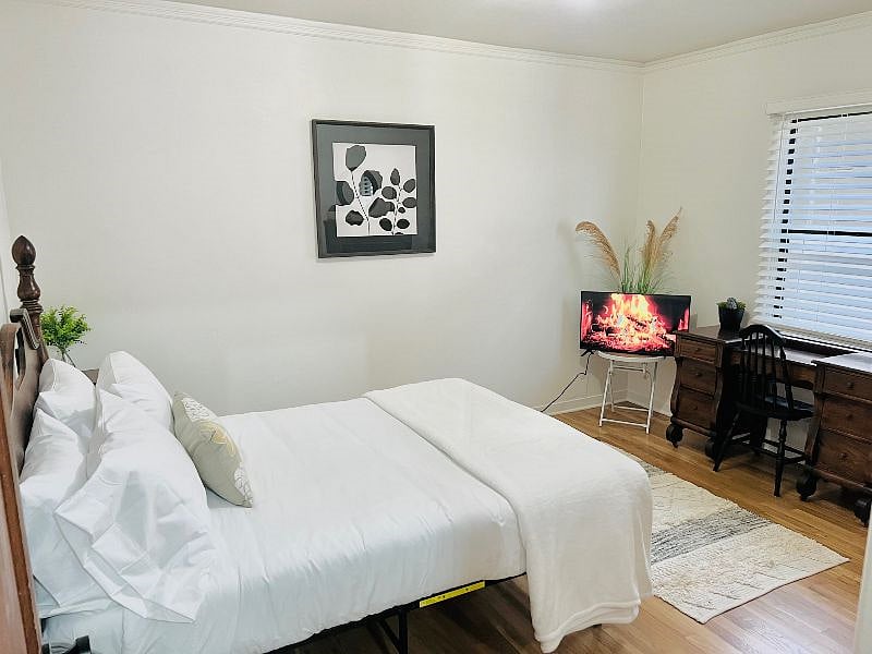 This second bedroom has a comfy full memory foam bed and TV