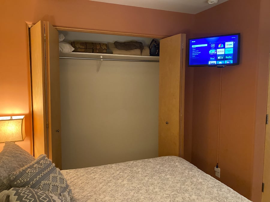 Sleeping Area Closet and TV