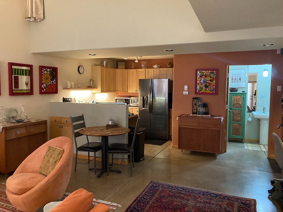 Livingroom toward Kitchen and 1/2 Bathroom with utility closet and Boiler